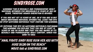 Anal pirate Sindy Rose ruin her ass with curvy huge anal dildo on the beach